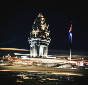 View of illuminated road at night