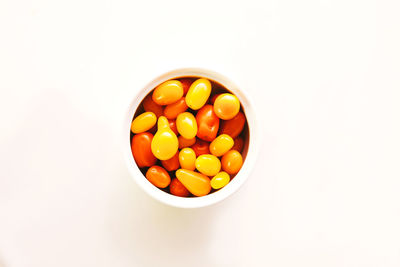 High angle view of eggs in bowl against white background