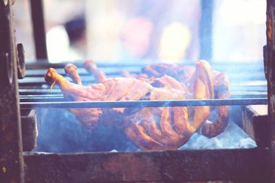 Chicken being grilled on barbecue