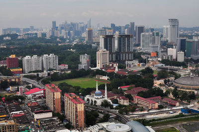 High angle view of buildings in city against sky