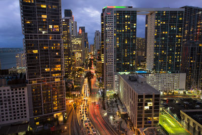 High angle view of city lit up at night