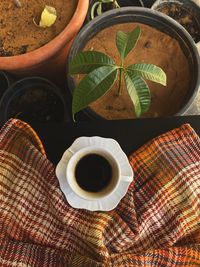 High angle view of coffee cup on table