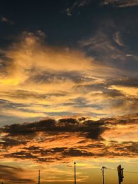 Low angle view of dramatic sky during sunset