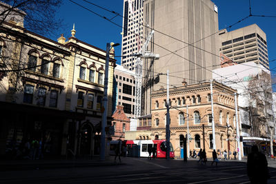 People walking on street in city