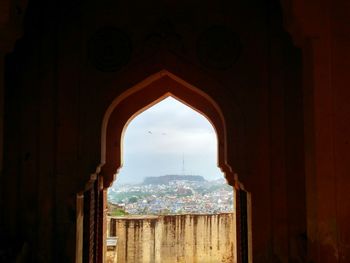 Cityscape seen through arch