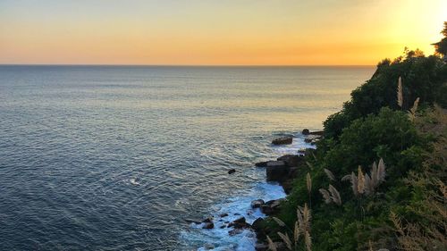 Scenic view of sea against sky during sunset