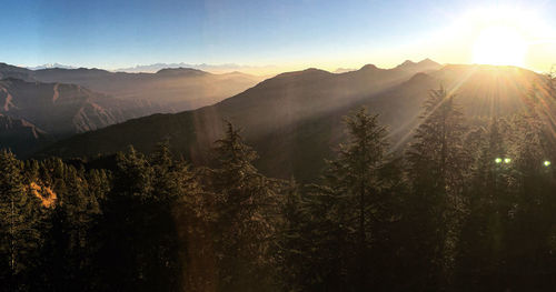 Scenic view of mountains against sky during sunset