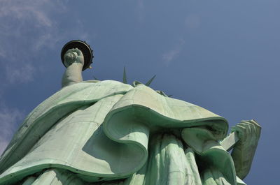 Low angle view of statue against cloudy sky