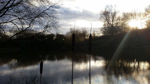 Scenic view of lake at sunset