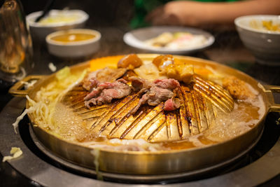 High angle view of meat in plate on table