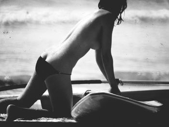 Low section of woman sitting outdoors