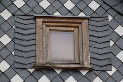 Close-up of window on brick wall