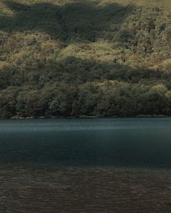 Scenic view of sea against mountain