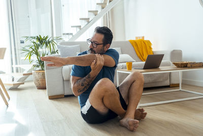 Young woman exercising at home