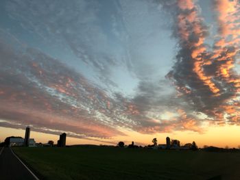 Silhouette landscape against sky during sunset