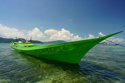 Boat in sea against sky