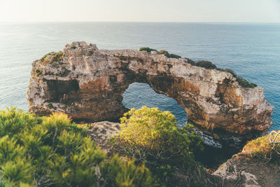 Scenic view of sea with giant rockformation