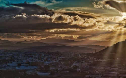 High angle view of town at sunset