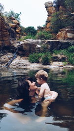 Mother and baby in lake