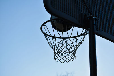 Low angle view of basketball hoop against sky