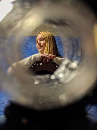 Portrait of smiling young woman in water