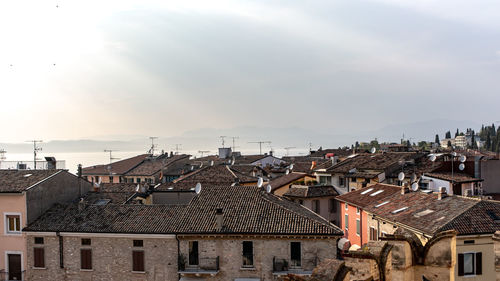 Buildings in city against sky