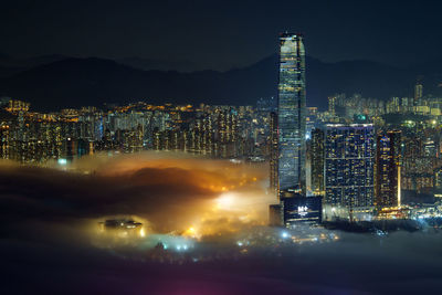 Illuminated buildings in city at night