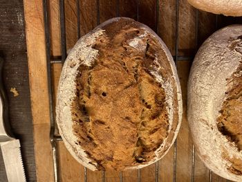 High angle view of bread in container on wooden table