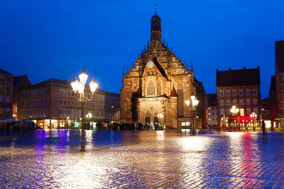 Illuminated buildings in city at night