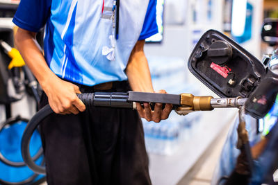 Midsection of man working in factory
