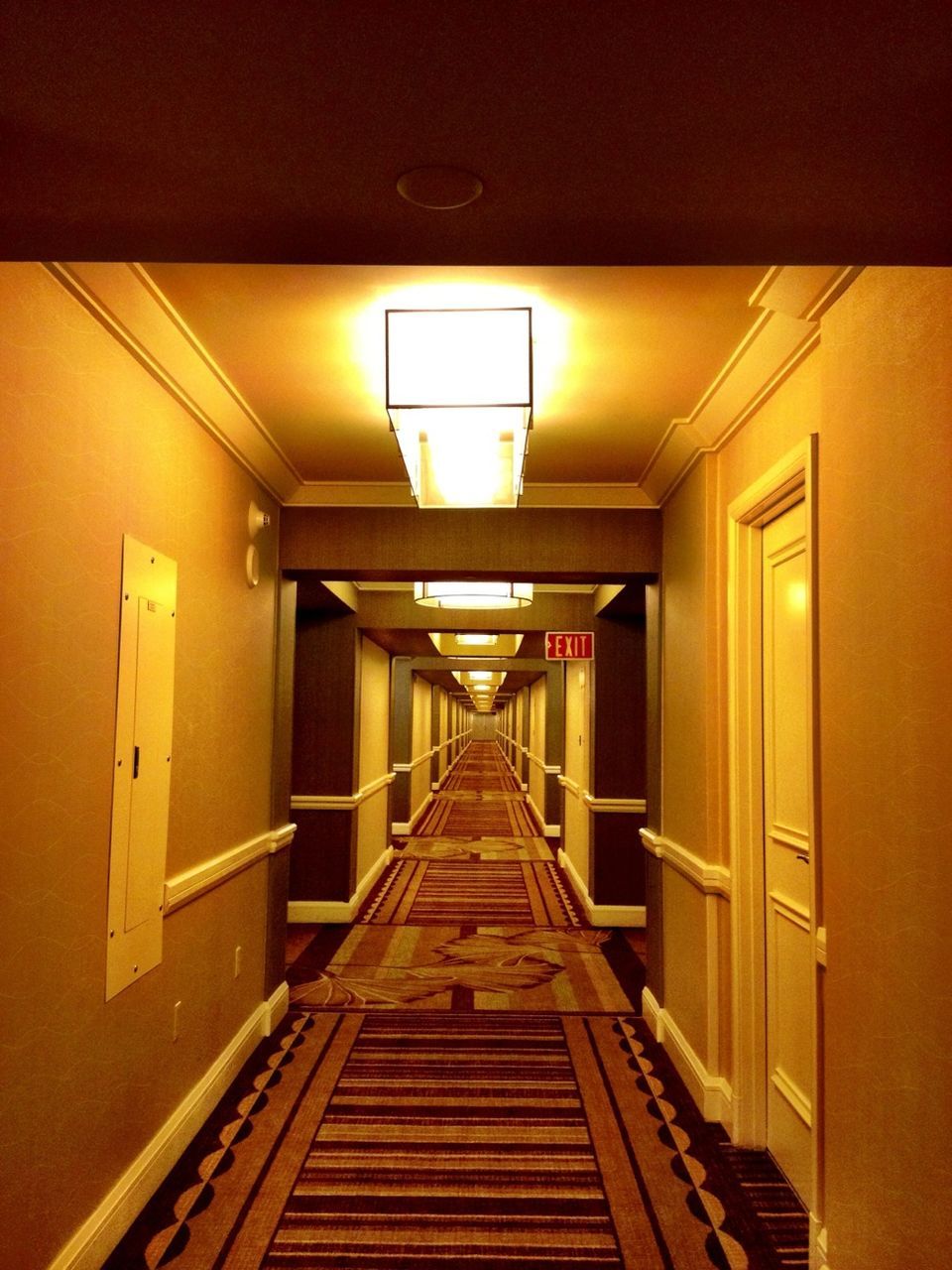 architecture, built structure, the way forward, illuminated, diminishing perspective, indoors, lighting equipment, vanishing point, ceiling, building exterior, railing, empty, narrow, building, steps, no people, absence, corridor, long, in a row