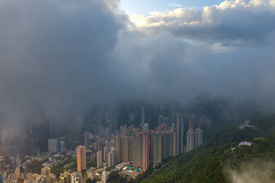 Panoramic shot of modern buildings in city against sky