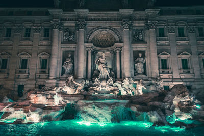 Fountain by historic building