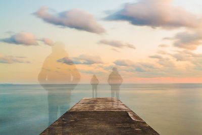 Multiple image of man standing on pier against sea during sunset