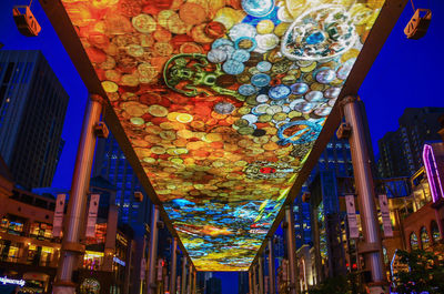 Low angle view of illuminated lanterns hanging in building