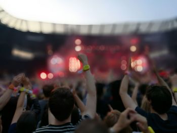 Blurred view of concert and people enjoying