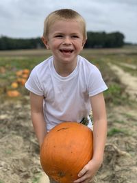 Portrait of a smiling boy on field