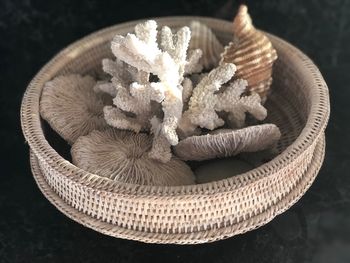 High angle view of garlic in basket on table
