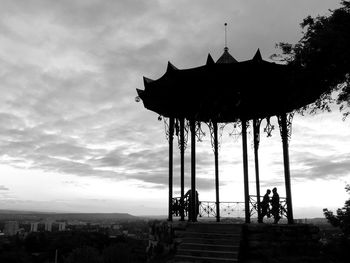 Silhouette people against sky during sunset