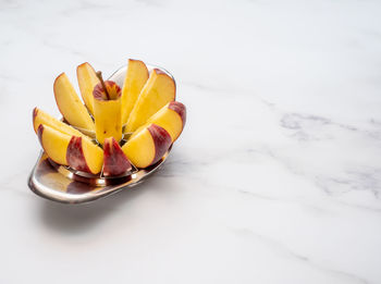 High angle view of fruits in plate on table