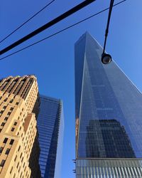 Low angle view of one world trade center against clear sky