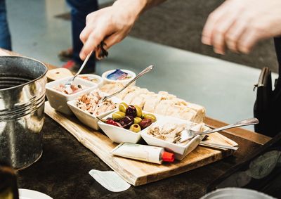 Midsection of person preparing food on table