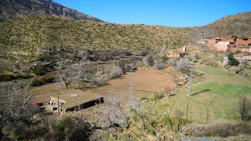 High angle view of houses and mountains against clear sky