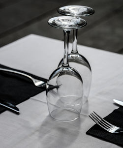 Close-up of wine glasses on table