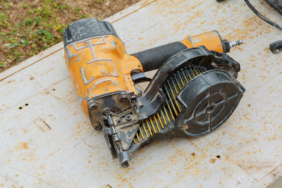 High angle view of machinery on wood at construction site