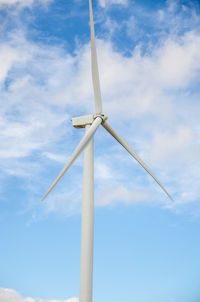 Low angle view of wind turbine against sky