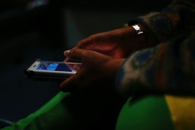 Close-up of man using mobile phone
