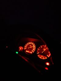 Close-up of illuminated clock in car