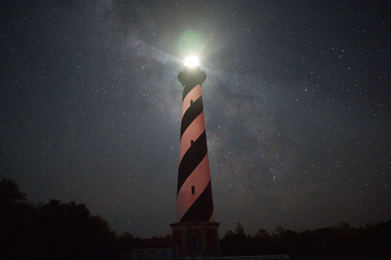 LOW ANGLE VIEW OF ILLUMINATED TOWER AGAINST SKY