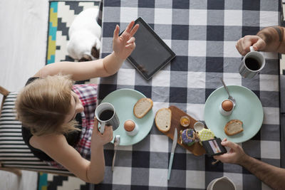 Directly above shot of people having breakfast at table